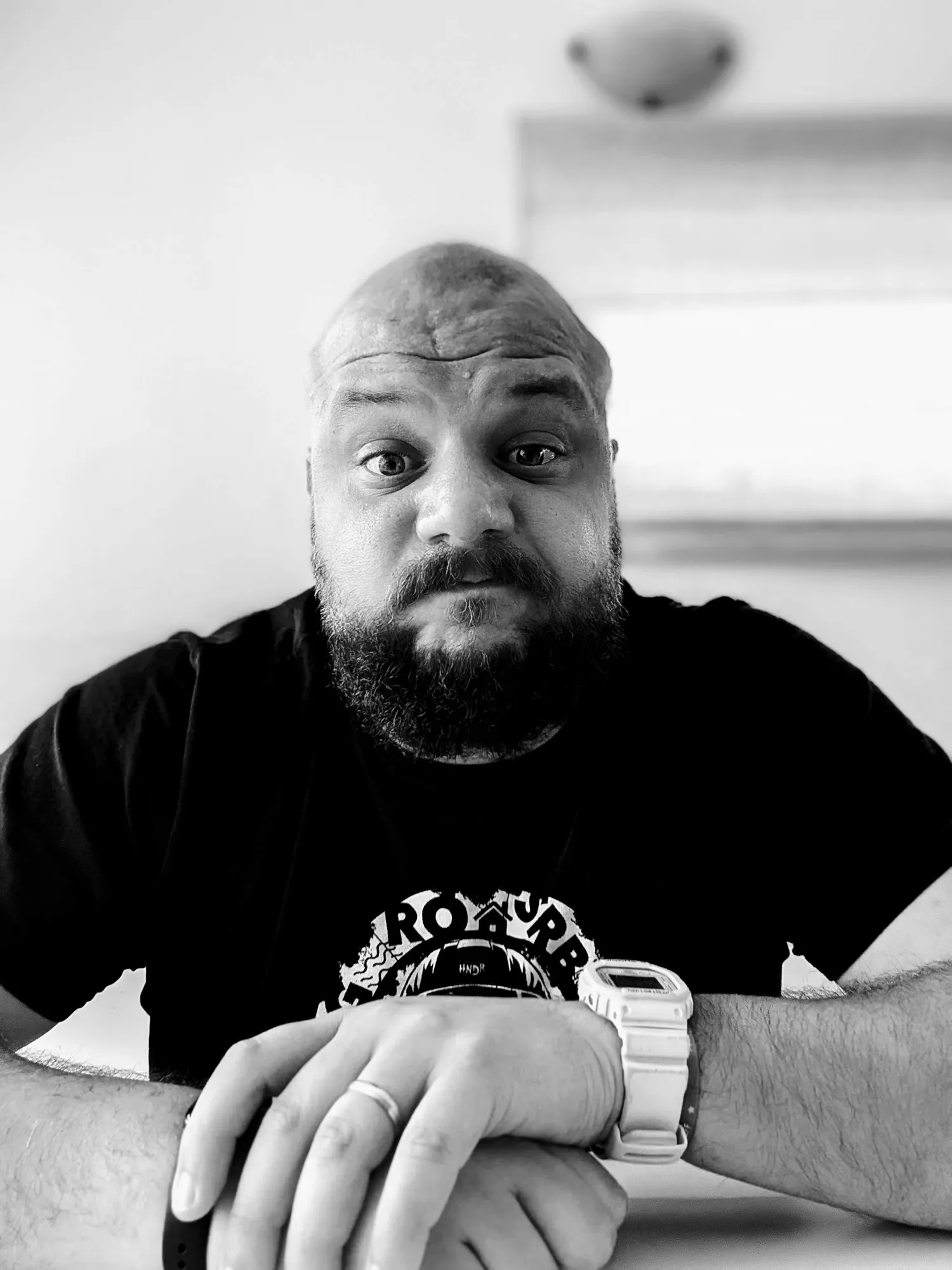 Alex, who runs Ascent Labs, arms folded and looking at the camera